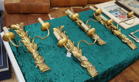 A set of four gilt plaster two branch wall sconces